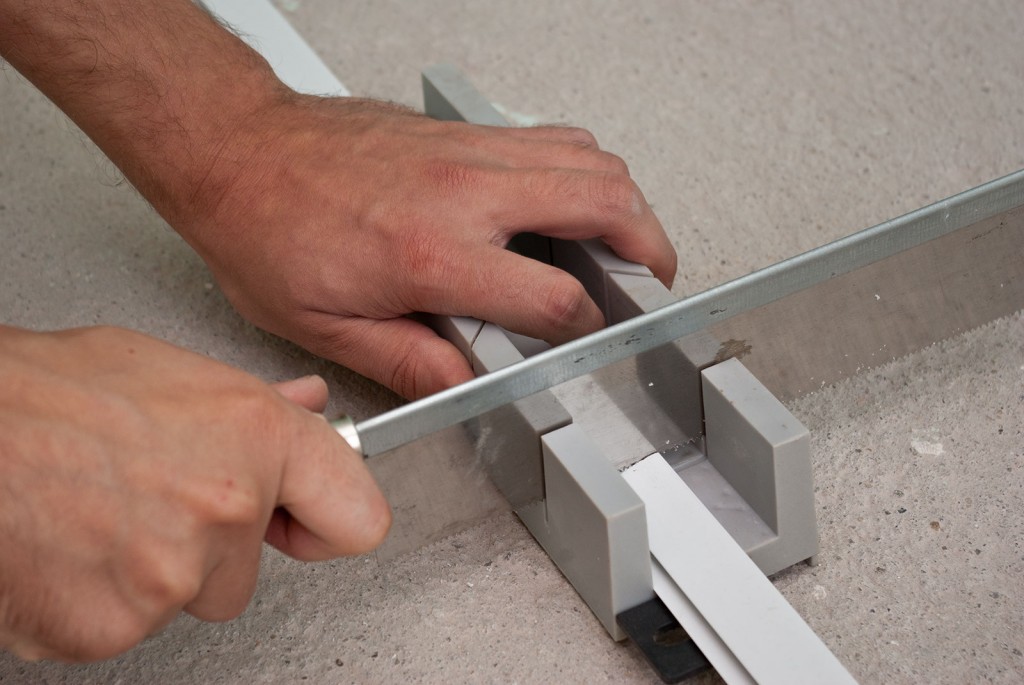 Cutting the end molding with a mitre box