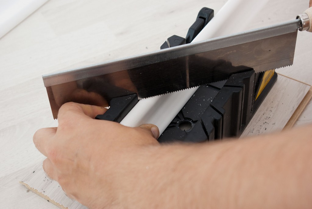 Cutting baseboard with mitre box