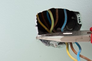 Cleaning the paint and drywall mud of the junction box