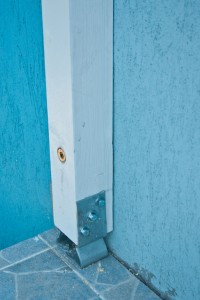Fixing the post against the house