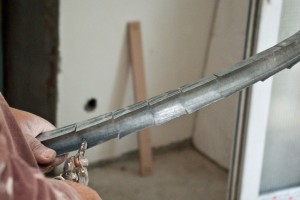 Cutting the metal studs to build the arch