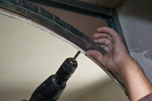 Fstening the drywall arch to the metal frame