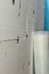 Installing fiberglass reinforcement net to polystyrene sheets