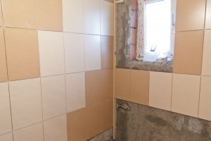 Installing tile around bathroom window