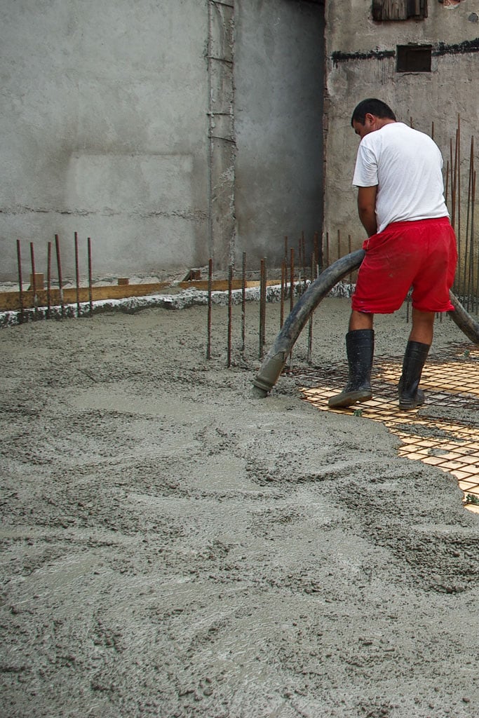 Pouring concrete with hose