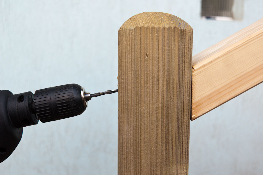 Drilling hole in deck post to fasten handrail
