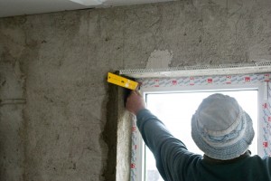 Using a L-square to install the corner bead Using a L-square to install the corner bead