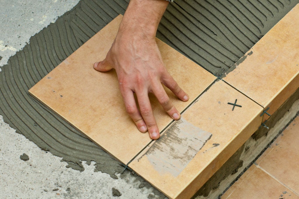 Setting tile flooring