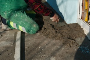 Spreading screed with a margin trowel Spreading screed with a margin trowel