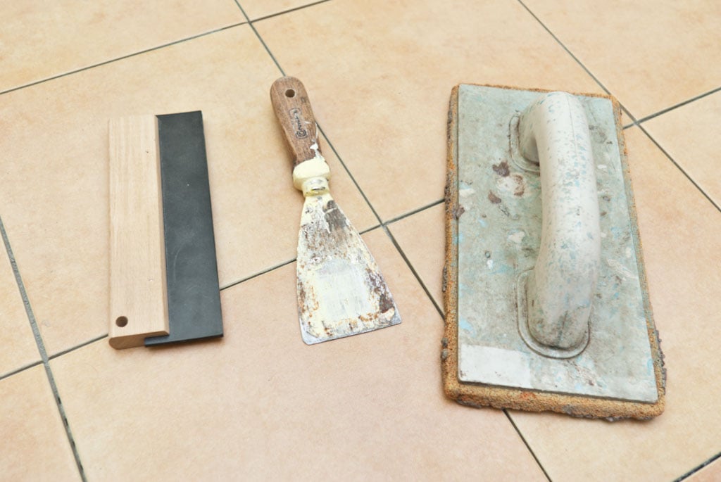 Tools for grouting floor tiles