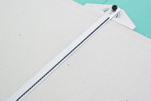 Using a T-square to cut drywall Using a T-square to cut drywall