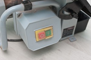 Wet saw start and stop buttons