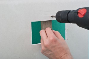 Securing the wood strip with screws