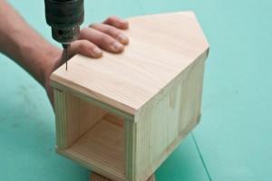 Drilling pilot holes in the wood pieces