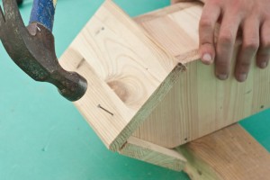 Driving in nails to lock the roof