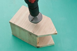 Cutting out the birdhouse entrance